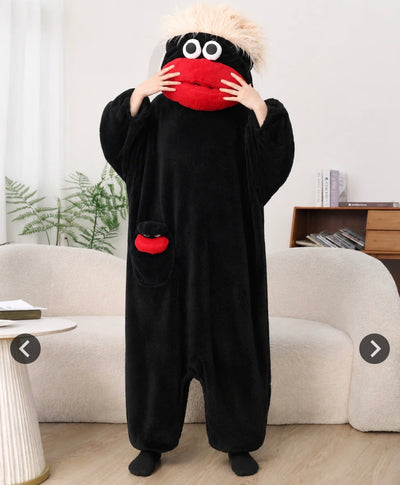 Black monster onesie with red mouth and white hair
